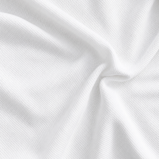 Spun Nirmal knit fabric
white knitted fabric
breathable apparel fabric
polyester knit fabric
wholesale T-shirt fabric
bulk fabric supplier
Close-up of white Spun Nirmal Knit fabric arranged in soft folds, showing its smooth knitted texture and lightweight drape.