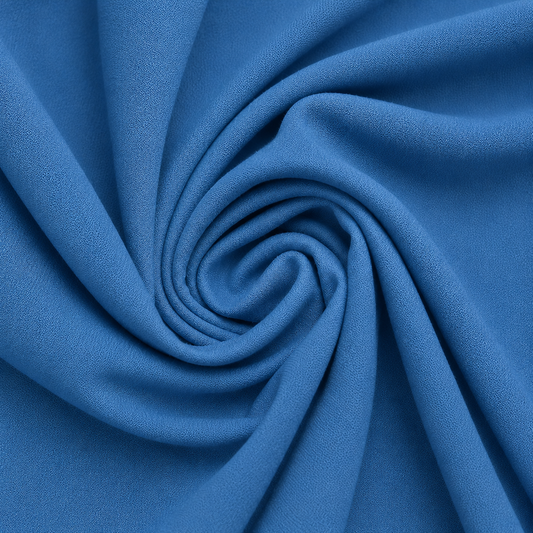 crepe lycra fabric
blue stretch fabric
stretch crepe fabric
activewear fabric wholesale
apparel lycra fabric
bulk fabric supplierClose-up of blue crepe lycra stretch fabric arranged in soft spiral folds, showing its smooth texture and flexible drape.