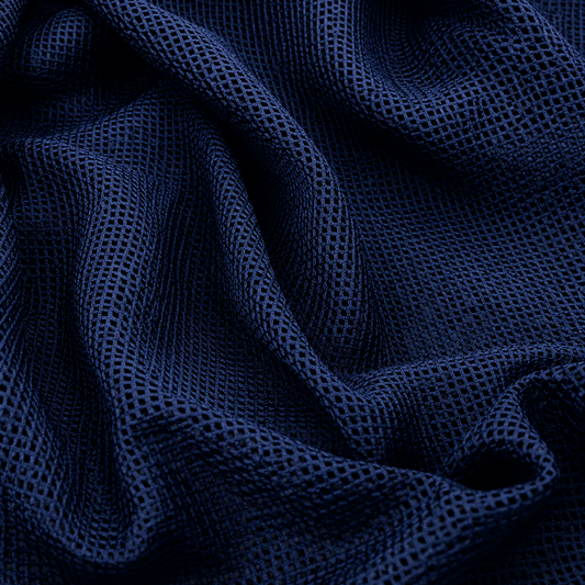 breathable mesh fabric
navy blue mesh fabric
sportswear mesh fabric
polyester mesh fabric
wholesale mesh fabric
bulk mesh fabric supplierClose-up of dark navy blue breathable mesh fabric with an open net-knit texture arranged in soft folds.