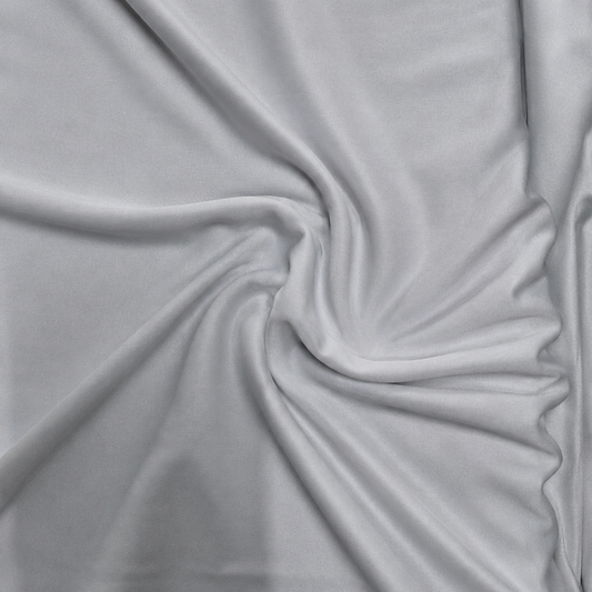 PP110 polyester fabric
white sportswear fabric
lightweight polyester fabric
moisture-wicking fabric
wholesale activewear fabric
bulk T-shirt fabric supplier
Close-up of white PP110 polyester fabric arranged in soft folds, showing its smooth lightweight texture for sportswear and activewear.